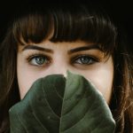 women beside green leaf