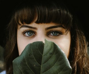 women beside green leaf