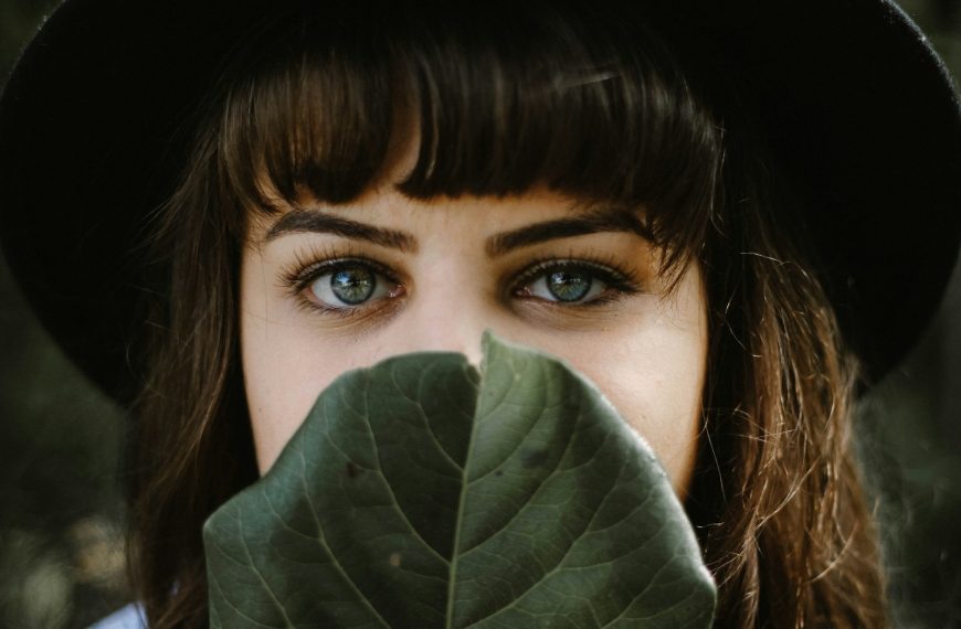 women beside green leaf