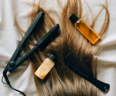 Aesthetic flat lay of hair products and tools for styling and grooming.