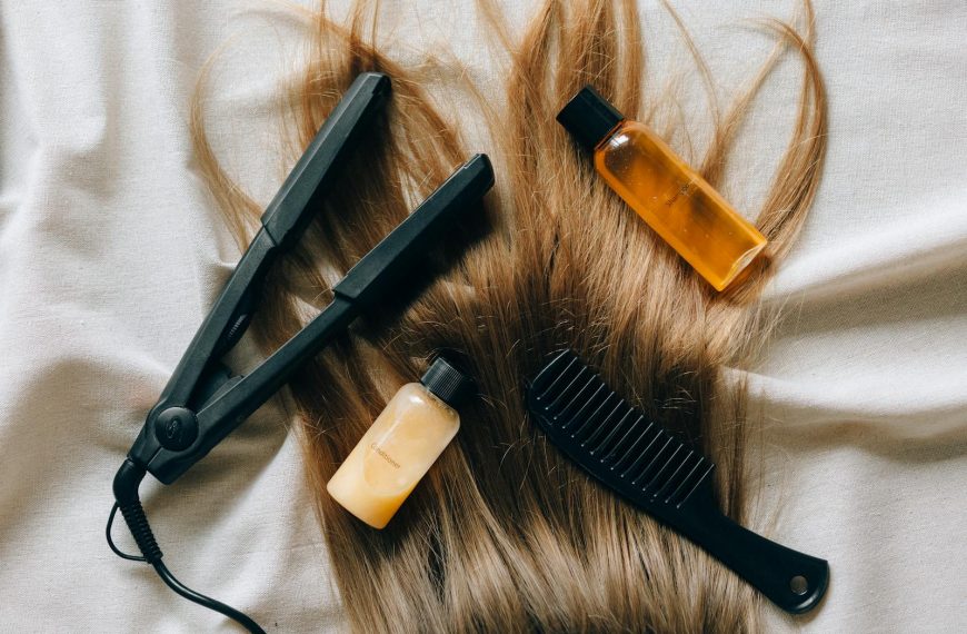 Aesthetic flat lay of hair products and tools for styling and grooming.
